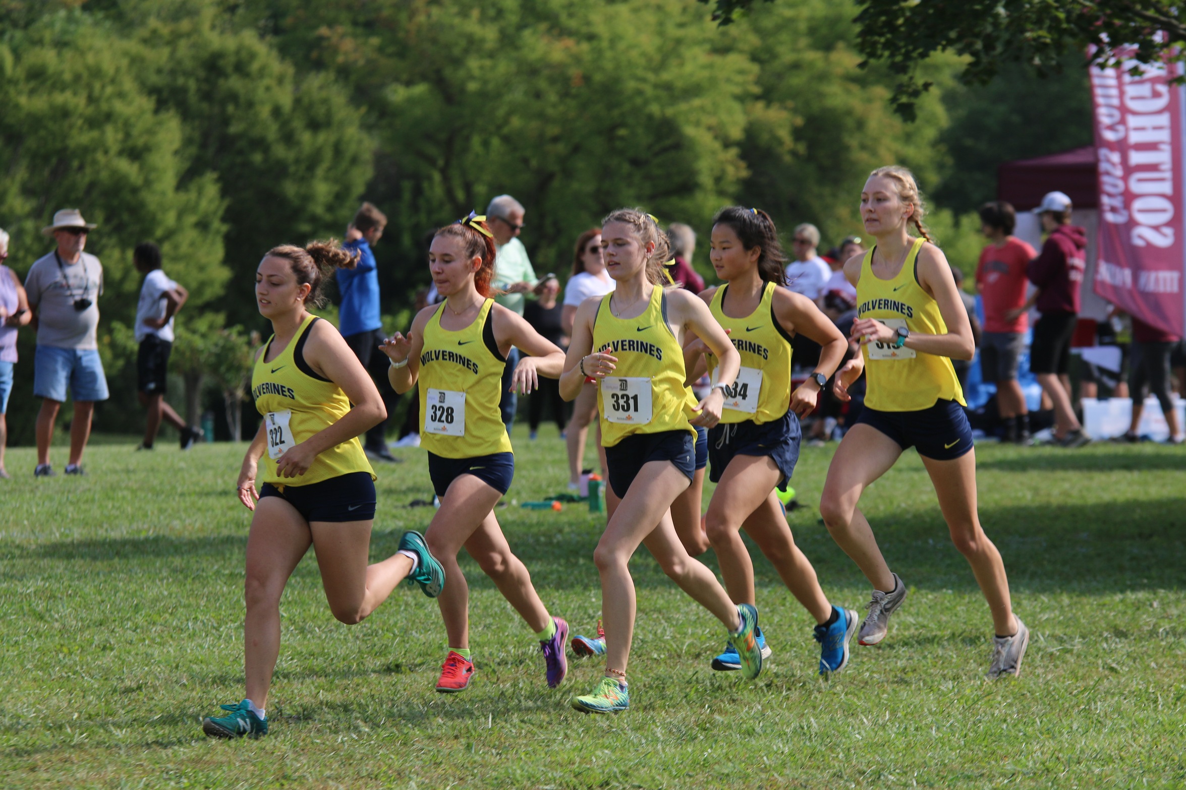 Wolverines harriers at the Detroit Mercy Titan Invitational Saturday at Cass Benton Park in Northville.