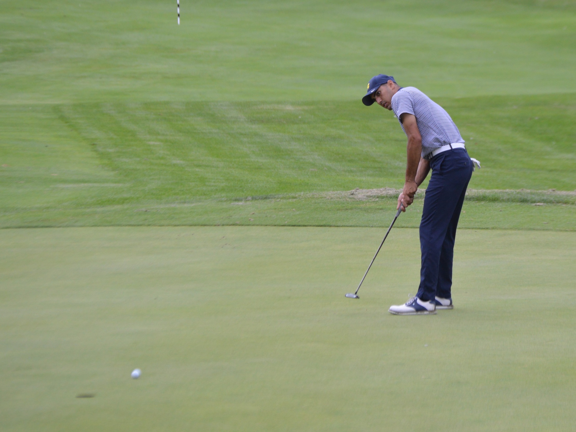 Mahmoud Saad, seen here draining a putt in earlier action this season, scored a 77 Monday in Battle Creek.