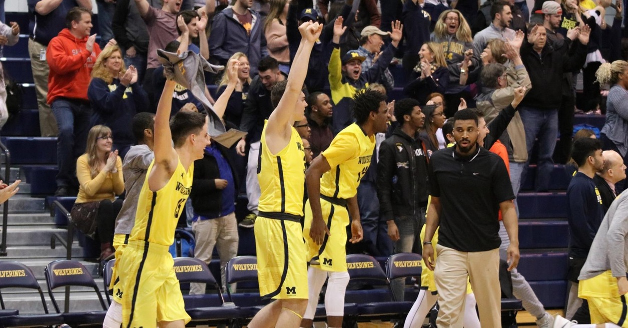 WOLVERINES CLOSE ON 15-0 RUN TO SHOCK CRUSADERS