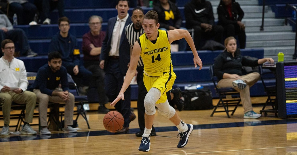 Racers rally late to upset Wolverines